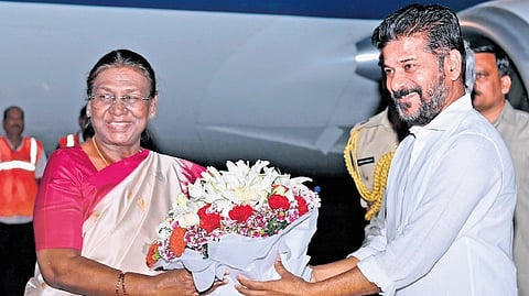 Chief Minister A Revanth Reddy receives President Droupadi Murmu at the Begumpet airport in Hyderabad on Thursday