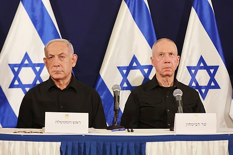 Israeli Prime Minister Benjamin Netanyahu, left, and Defense Minister Yoav Gallant attend a press conference in the Kirya military base in Tel Aviv, Israel, Saturday, Oct. 28, 2023.