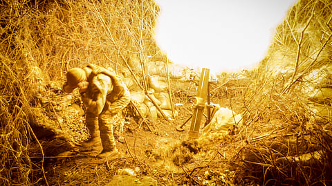 In this photo provided by Ukraine's 24th Mechanised Brigade press service, servicemen of the 24th Mechanised Brigade fire 120mm mortar towards Russian positions near Chasiv Yar town, in Donetsk region, Ukraine, Tuesday, Nov. 19, 2024