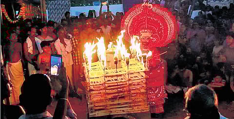 A theyyam performance at a temple in Kannur