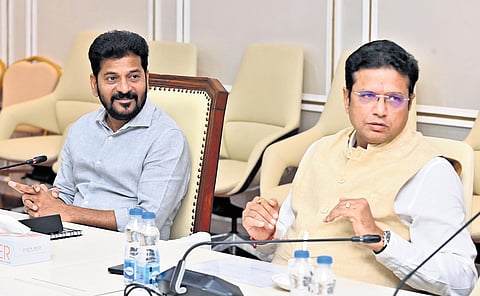 Chief Minister A Revanth Reddy along with Industries Minister D Sridhar Babu at the meeting with representatives of various firms at Secretariat on Friday
