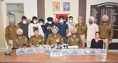 Punjab Police with the accused of the trans-border arms smuggling.