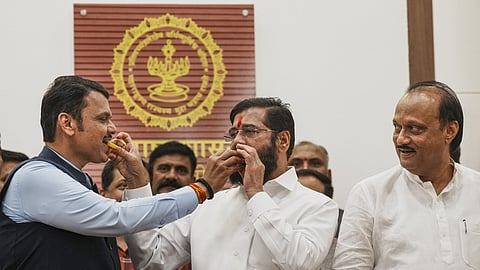 Maharashtra caretaker Chief Minister Eknath Shinde with Deputy Chief Ministers Devendra Fadnavis and Ajit Pawar celebrates the election victory