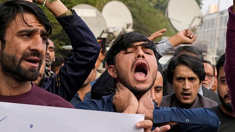 Shiite Muslims chant slogans to condemn the killing of Shiite Muslims by gunmen in an ambush in Kurram district, during a demonstration in Lahore, Pakistan.