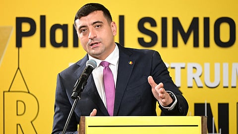 Presidential candidate and leader of the far-right Alliance for the Unity of Romanians AUR party, George Simion, addresses a press conference at his party's headquarters in Bucharest on November 20.
