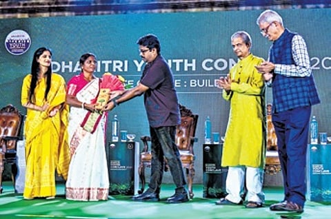 Environmentalist Jamuna Tudu (second from left) being given the lifetime achievement award at Dharitri Youth Conclave in Bhubaneswar on Sunday