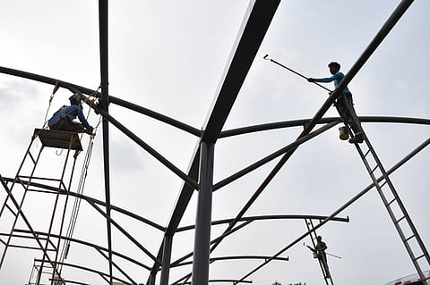 Workers busy engaged in final stage of renovation work at Gandhipuram omni bus stand in Coimbatore.
