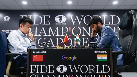 Ding Liren (L) and D Gukesh