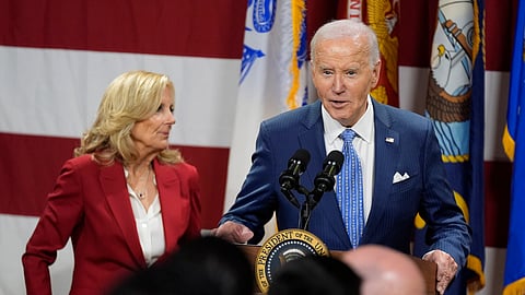 President Joe Biden speaks as first lady Jill Biden looks on at a Friendsgiving event with service members and their families in the Staten Island borough of New York, Monday, Nov. 25 2024.