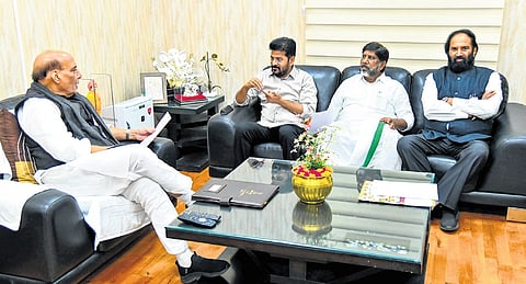 Chief Minister A Revanth Reddy, Deputy CM Mallu Bhatti Vikramarka and Irrigation Minister N Uttam Kumar Reddy with Defence Minister Rajnath Singh in New Delhi