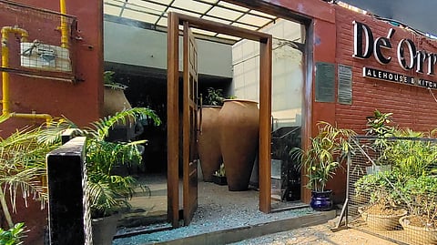 Pieces of broken window glass lie on the floor after an explosion outside a club in Chandigarh