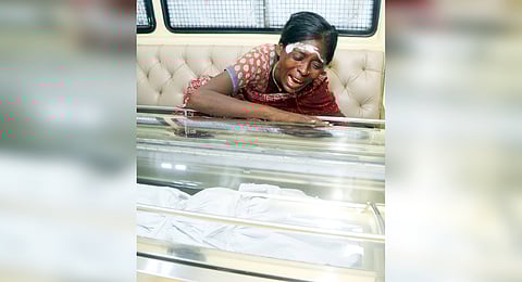 Ponnamma weeping after seeing mortal remains of her nephew Jeeva.