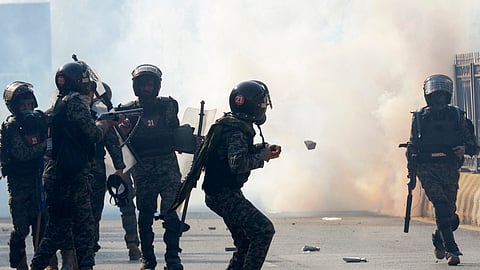 Paramilitary soldiers fire tear gas shells to disperse supporters of imprisoned former premier Imran Khan's Pakistan Tehreek-e-Insaf party during clashes in Islamabad, Pakistan, Tuesday, Nov. 26, 2024.