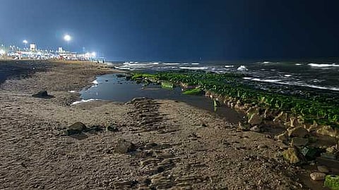 Caption: The seawater receding along the Tiruchendur Murugan temple beach in Thoothukudi.