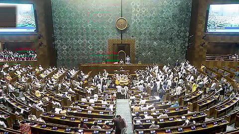 Opposition members protest in the Lok Sabha during the Winter session of Parliament in New Delhi, Thursday, Nov. 28, 2024.