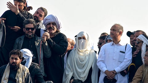 Bushra Bibi, center, wife of imprisoned former premier Imran Khan and leaders of Khan's party lead their supporters during a rally demanding Khan's release, in Islamabad, Pakistan.