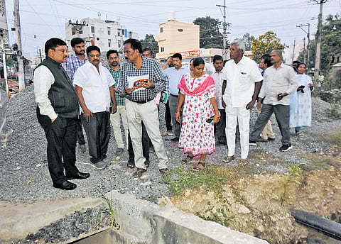 GMC chief P Srinivasulu inspecting road works at AT Agraharam in Guntur