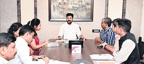 Chief Minister A Revanth Reddy along with enumerators of the caste survey at his residence in Jubilee Hills on Thursday