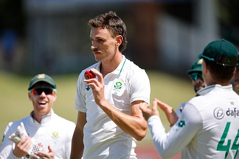 South Africa's Marco Jansen (C) holds the ball as he celebrates taking 7 wickets (Photo | AFP)