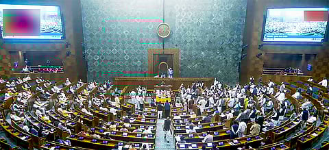 Opposition MPs protest over Adani and 'Sambhal issues in Lok Sabha during the Winter Session of Parliament in New Delhi.