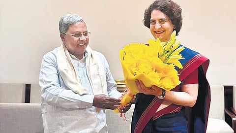 Chief Minister Siddaramaiah greets newly elected Wayanad MP Priyanka Gandhi Vadra during the CWC meeting in New Delhi on Friday