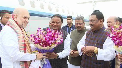 Chief Minister Mohan Charan Majhi receives Union Home Minister Amit Shah at Biju Patnaik International Airport in Bhubaneswar.
