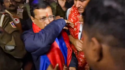 Former Delhi chief minister and AAP chief Arvind Kejriwal reacts after a man allegedly splashed some liquid on the former during his 'padyatra', in New Delhi, Saturday, Nov. 30, 2024.