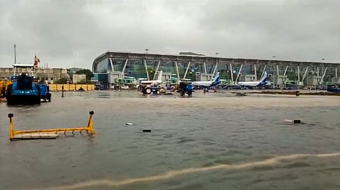An area is seen inundated with rainwater at the airport amid heavy rainfall, in Chennai.