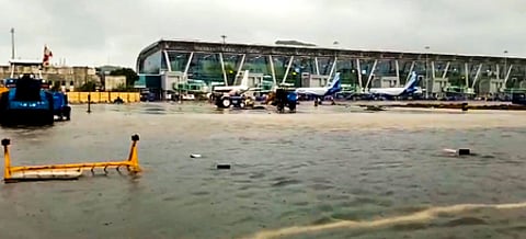 An area is seen inundated with rainwater at the airport amid heavy rainfall in Chennai on Saturday (Photo | PTI)