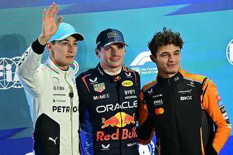 Mercedes' British driver George Russell (L) Red Bull Racing's Dutch driver Max Verstappen (C), and McLaren's British driver Lando Norris (R)