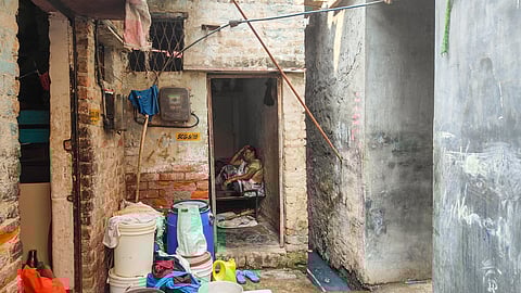 A construction worker sits at her home in absence of employment opportunities, in Haiderpur area of New Delhi, Tuesday, Nov. 12, 2024.