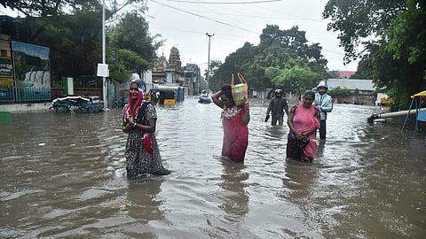 Residents traverse through waterlogged streets as rains lash different part of Tamil Nadu.