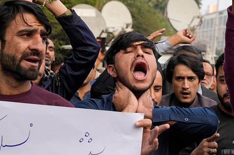 Shiite Muslims chant slogans to condemn the killing of Shiite Muslims by gunmen in an ambush in Kurram district, during a demonstration in Lahore, Pakistan