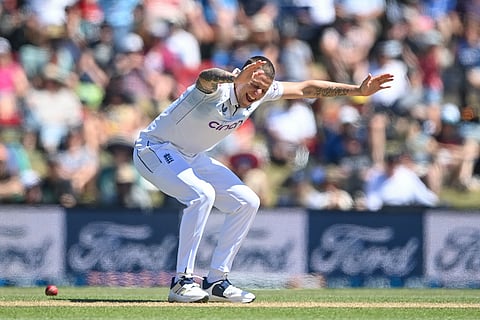 England's Brydon Carse celebrates after taking a wicket during play on the fourth day of the first cricket test between England and New Zealand at Hagley Oval in Christchurch, New Zealand, Sunday, Dec. 1, 2024.