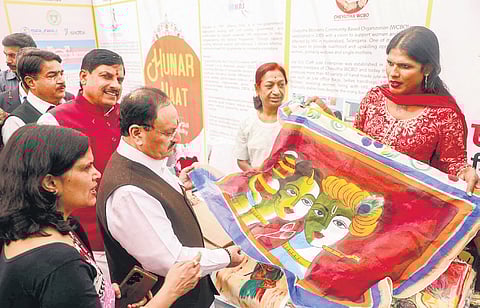 Union health minister JP Nadda with Madhya Pradesh Chief Minister Mohan Yadav visits an exhibition at Hunat Haat in Indore on Sunday.