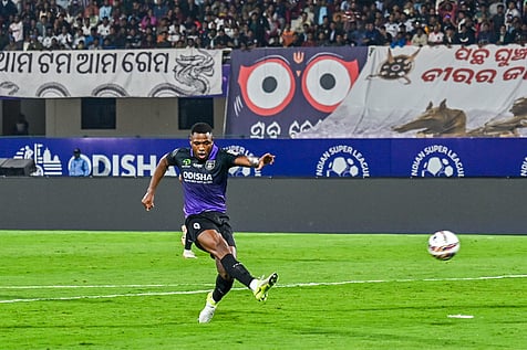 Diego MaurÃcio of Odisha FC strike the ball that becomes 4th goal against Bengaluru FC at Kalinga Stadium in Bhubaneswar