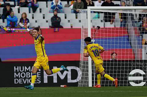 Las Palmas' Fabio Silva celebrates after scoring his side's 2nd goal against Barcelona during a Spanish La Liga soccer match at the Lluis Companys Olympic Stadium in Barcelona, Spain, Saturday Nov. 30, 2024.