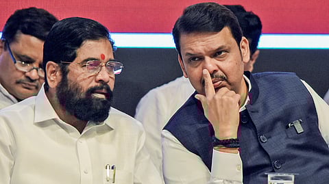 BJP leader Devendra Fadnavis (R) with Shiv Sena Chief Eknath Shinde.