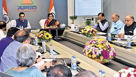 Andhra Pradesh Chief Secretary Neerabh Kumar Prasad and his Telangana counterpart Santhi Kumari during the meeting in Mangalgiri on Monday