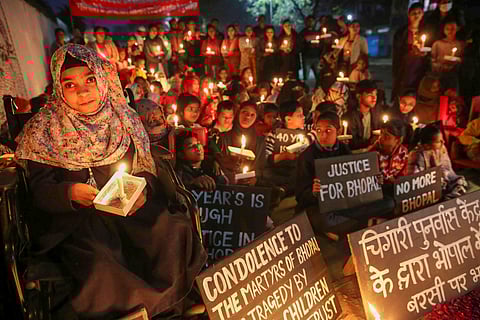 Children born with congenital disabilities, believed to be caused by the exposure of their parents to gas leakage during the Union Carbide gas leak disaster, along with their relatives and supporters, take part in a candlelight vigil to pay homage to those killed in the 1984 Bhopal gas tragedy, marking the disaster's 40th anniversary.