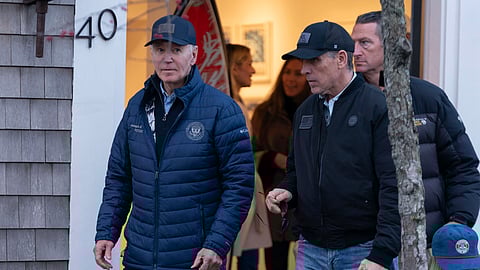 President Joe Biden and son Hunter Biden walk in downtown Nantucket Mass., Friday, Nov. 29, 2024.