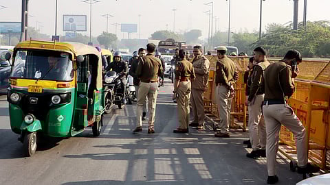 Police personnel deployed at Chilla border after security was heightened in view of farmers' protest march towards the national capital, in Noida, on Monday.