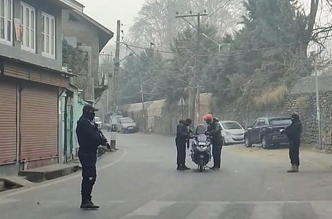 Security personnel check a vehicle on a road amid a joint operation by Indian Army & J&K Police in the Harwan area in Srinagar on Tuesday, Dec. 3, 2024.