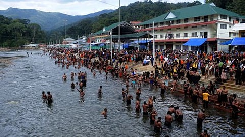 Devotees taking a dip at Pamba River