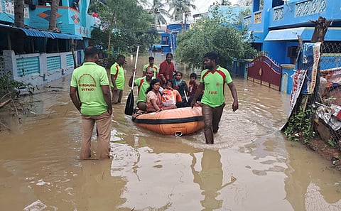 The fire and rescue team used a rubber boat to carry out the rescue operation in the flood-affected residential areas of Semmandalam, Cuddalore.