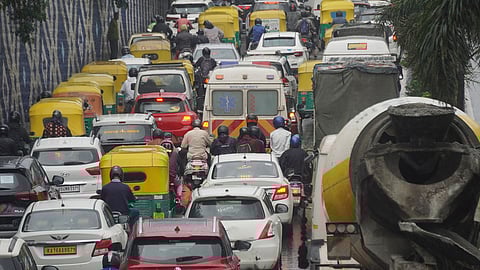 Heavy traffic during the rain at Guttahalli main in Bengaluru.