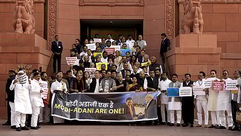 Congress MP Gaurav Gogoi, RJD MP Manoj Jha, Shiv Sena (UBT) MP Priyanka Chaturvedi and other opposition MPs stage a protest during the Winter session of Parliament, in New Delhi, Wednesday, Dec. 4, 2024.