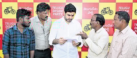 HRD Minister N Lokesh taking petitions from the public during Praja Darbar
