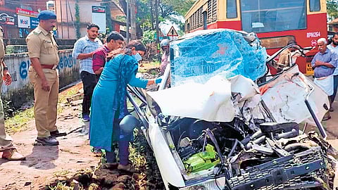 Forensic experts examine the car that rammed a KSRTC bus in Alappuzha; the bus involved in the accident is also seen