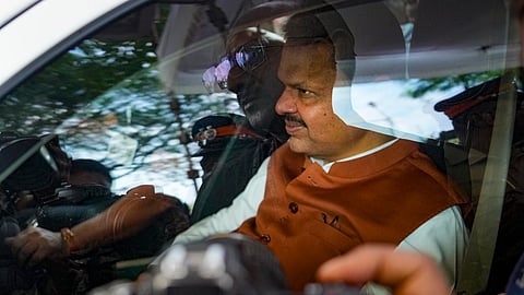 BJP leader Devendra Fadnavis arrives for the BJP legislature meeting at Vidhan Bhavan, in Mumbai.
